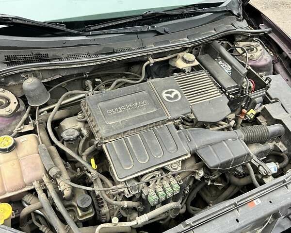 Фиолетовый Мазда 3, объемом двигателя 1.6 л и пробегом 232 тыс. км за 4800 $, фото 25 на Automoto.ua