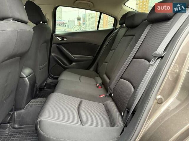 Коричневий Мазда 3, об'ємом двигуна 1.5 л та пробігом 246 тис. км за 11690 $, фото 9 на Automoto.ua