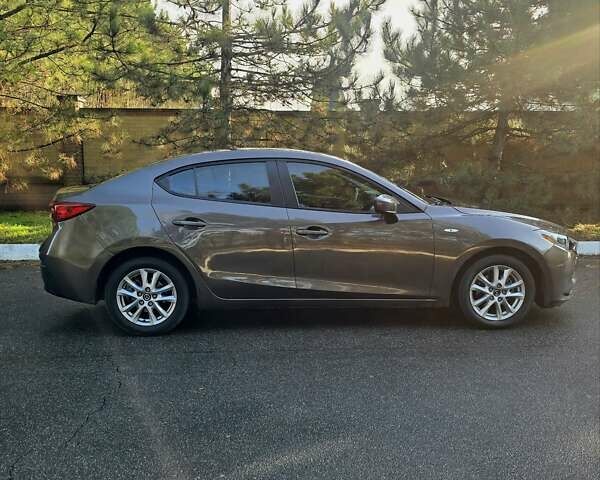 Коричневый Мазда 3, объемом двигателя 2 л и пробегом 175 тыс. км за 10400 $, фото 4 на Automoto.ua