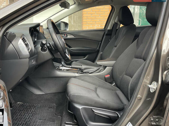 Коричневий Мазда 3, об'ємом двигуна 1.5 л та пробігом 98 тис. км за 15400 $, фото 22 на Automoto.ua