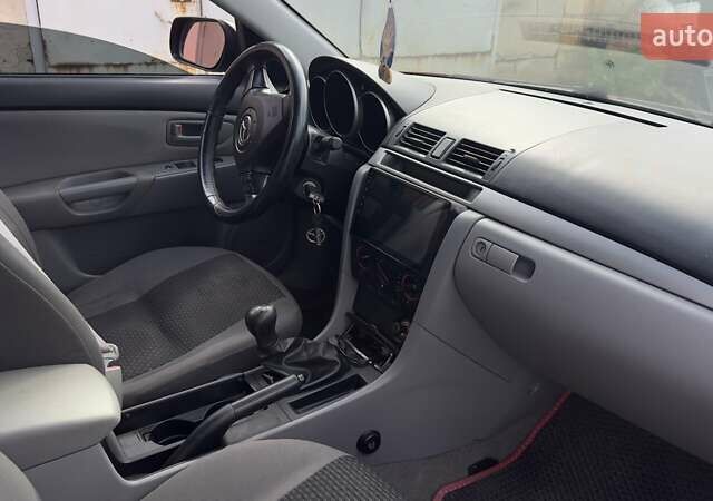 Красный Мазда 3, объемом двигателя 1.6 л и пробегом 216 тыс. км за 4100 $, фото 17 на Automoto.ua