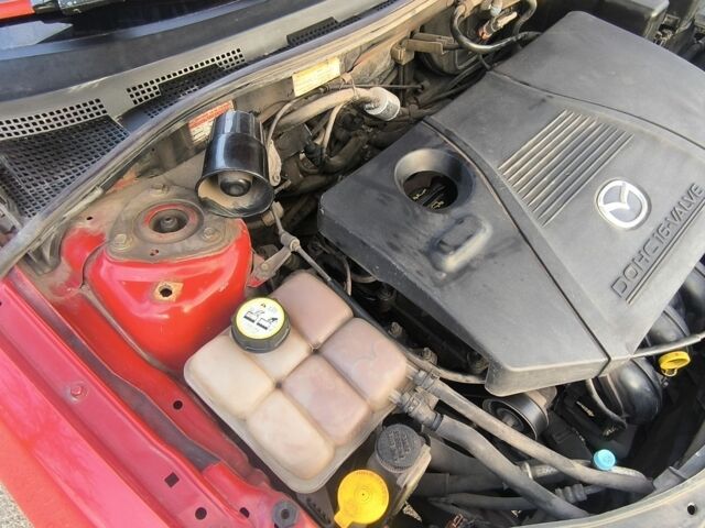 Червоний Мазда 3, об'ємом двигуна 2 л та пробігом 255 тис. км за 4800 $, фото 6 на Automoto.ua