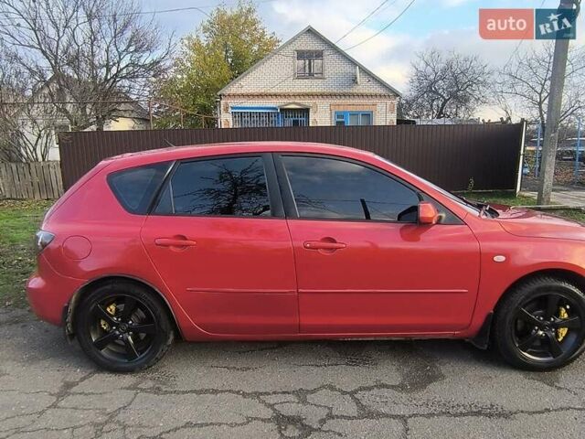 Красный Мазда 3, объемом двигателя 2 л и пробегом 256 тыс. км за 4800 $, фото 2 на Automoto.ua