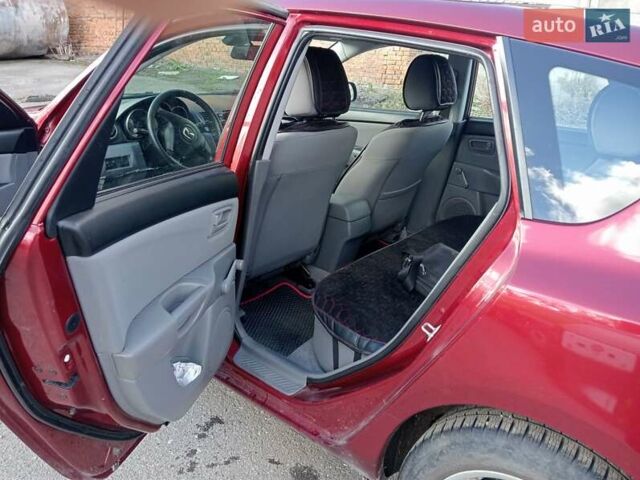 Червоний Мазда 3, об'ємом двигуна 1.35 л та пробігом 173 тис. км за 6200 $, фото 1 на Automoto.ua