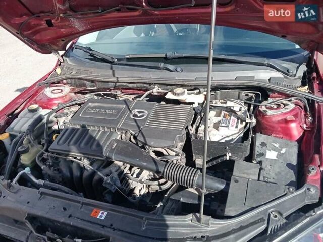 Червоний Мазда 3, об'ємом двигуна 1.35 л та пробігом 173 тис. км за 6200 $, фото 3 на Automoto.ua
