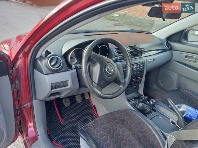 Червоний Мазда 3, об'ємом двигуна 1.35 л та пробігом 173 тис. км за 6200 $, фото 2 на Automoto.ua