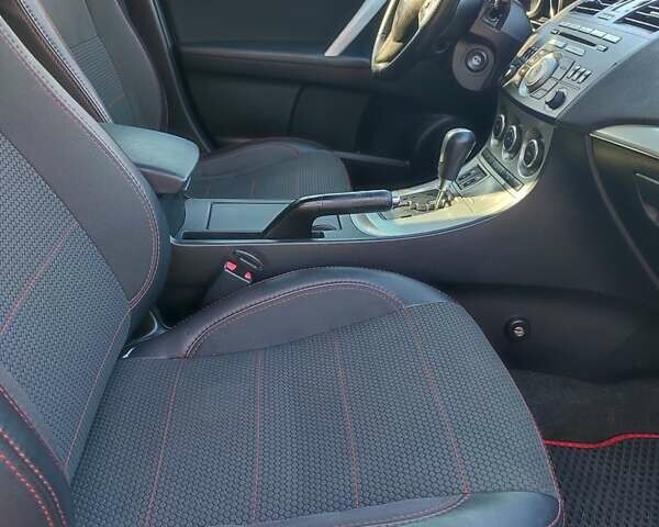 Красный Мазда 3, объемом двигателя 1.6 л и пробегом 192 тыс. км за 7300 $, фото 5 на Automoto.ua