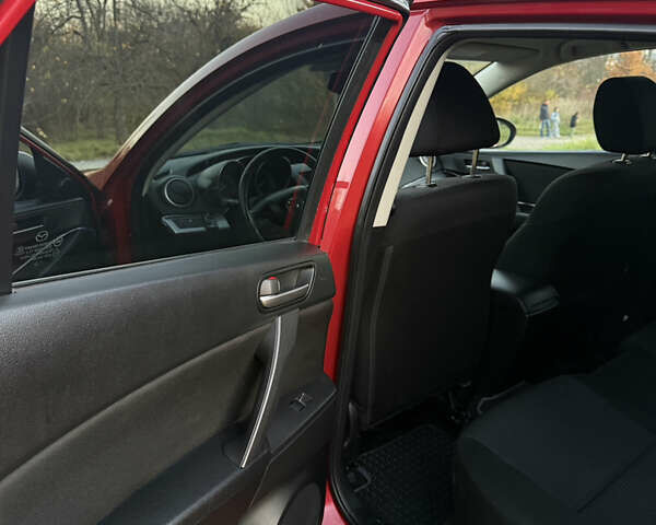 Красный Мазда 3, объемом двигателя 1.6 л и пробегом 51 тыс. км за 9800 $, фото 14 на Automoto.ua