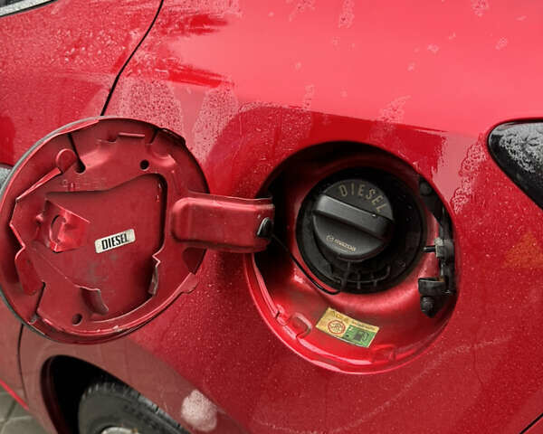 Красный Мазда 3, объемом двигателя 2.19 л и пробегом 208 тыс. км за 11850 $, фото 23 на Automoto.ua