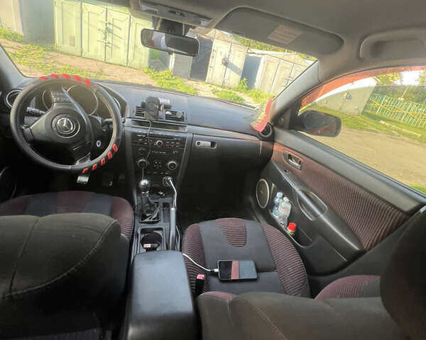 Червоний Мазда 3, об'ємом двигуна 2 л та пробігом 290 тис. км за 3990 $, фото 7 на Automoto.ua
