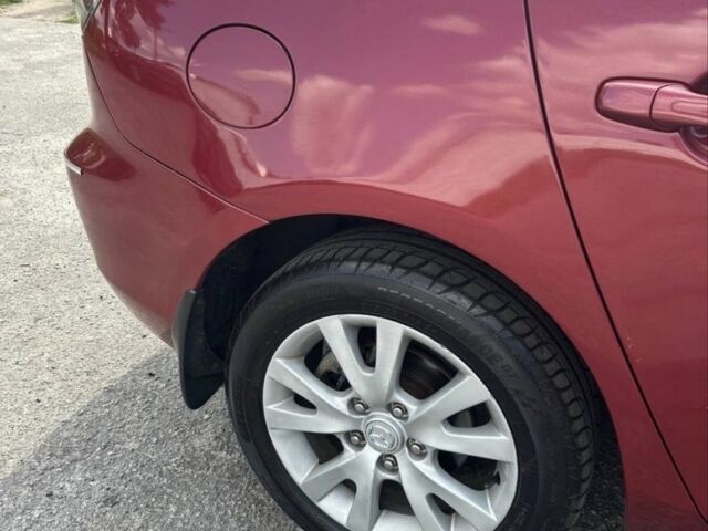 Красный Мазда 3, объемом двигателя 1.6 л и пробегом 300 тыс. км за 3500 $, фото 1 на Automoto.ua