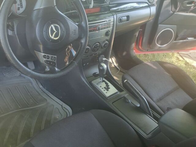 Красный Мазда 3, объемом двигателя 1.6 л и пробегом 120 тыс. км за 4000 $, фото 4 на Automoto.ua