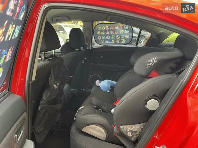 Красный Мазда 3, объемом двигателя 1.6 л и пробегом 106 тыс. км за 5600 $, фото 1 на Automoto.ua