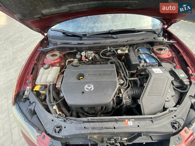 Красный Мазда 3, объемом двигателя 2 л и пробегом 244 тыс. км за 6800 $, фото 12 на Automoto.ua