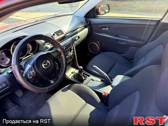 Красный Мазда 3, объемом двигателя 2 л и пробегом 200 тыс. км за 5400 $, фото 4 на Automoto.ua