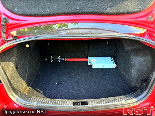 Красный Мазда 3, объемом двигателя 2 л и пробегом 200 тыс. км за 5400 $, фото 7 на Automoto.ua