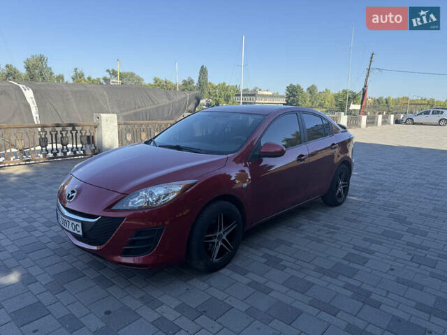 Красный Мазда 3, объемом двигателя 2 л и пробегом 225 тыс. км за 7700 $, фото 1 на Automoto.ua