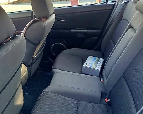 Красный Мазда 3, объемом двигателя 1.6 л и пробегом 185 тыс. км за 5500 $, фото 4 на Automoto.ua
