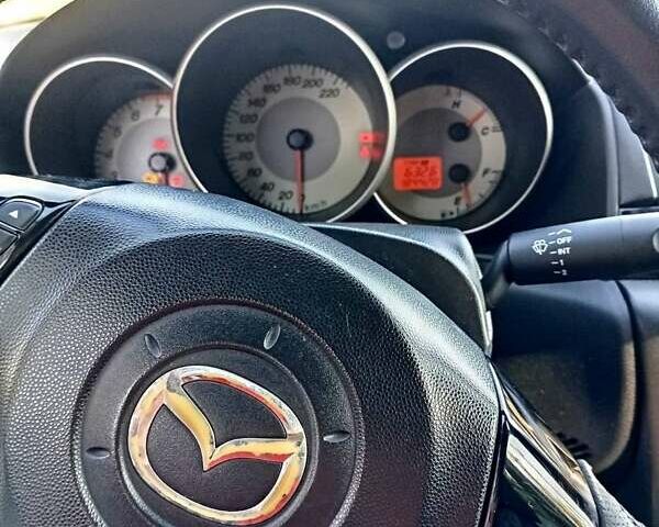 Красный Мазда 3, объемом двигателя 1.6 л и пробегом 185 тыс. км за 5500 $, фото 6 на Automoto.ua