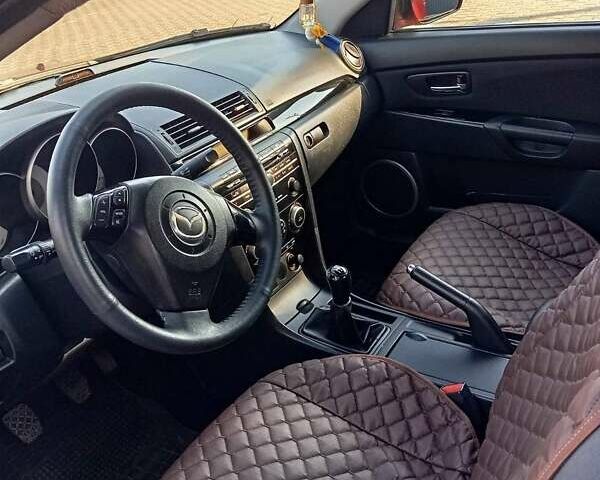 Красный Мазда 3, объемом двигателя 1.6 л и пробегом 185 тыс. км за 5500 $, фото 7 на Automoto.ua