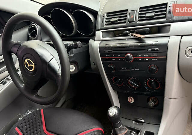 Мазда 3, объемом двигателя 1.3 л и пробегом 321 тыс. км за 2550 $, фото 6 на Automoto.ua