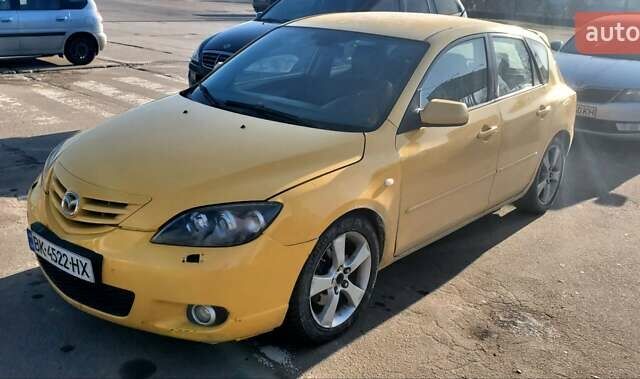Желтый Мазда 3, объемом двигателя 2 л и пробегом 270 тыс. км за 4000 $, фото 3 на Automoto.ua