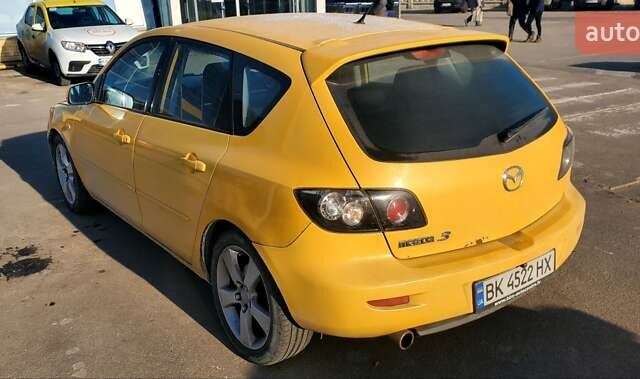 Желтый Мазда 3, объемом двигателя 2 л и пробегом 270 тыс. км за 4000 $, фото 2 на Automoto.ua