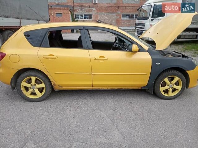 Желтый Мазда 3, объемом двигателя 2 л и пробегом 330 тыс. км за 2800 $, фото 6 на Automoto.ua