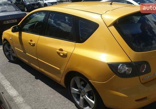 Желтый Мазда 3, объемом двигателя 2 л и пробегом 270 тыс. км за 4000 $, фото 4 на Automoto.ua