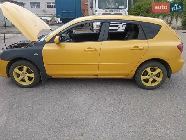 Желтый Мазда 3, объемом двигателя 2 л и пробегом 330 тыс. км за 2800 $, фото 3 на Automoto.ua