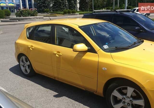 Желтый Мазда 3, объемом двигателя 2 л и пробегом 270 тыс. км за 4000 $, фото 5 на Automoto.ua