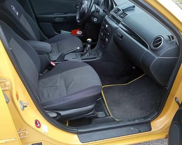 Желтый Мазда 3, объемом двигателя 2 л и пробегом 330 тыс. км за 2800 $, фото 7 на Automoto.ua