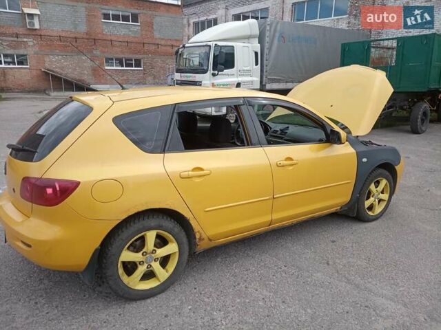 Желтый Мазда 3, объемом двигателя 2 л и пробегом 330 тыс. км за 2800 $, фото 5 на Automoto.ua