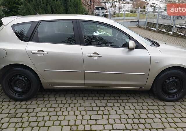 Жовтий Мазда 3, об'ємом двигуна 1.56 л та пробігом 191 тис. км за 2950 $, фото 5 на Automoto.ua
