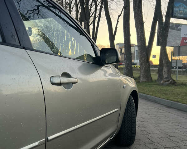 Жовтий Мазда 3, об'ємом двигуна 1.56 л та пробігом 190 тис. км за 3399 $, фото 6 на Automoto.ua