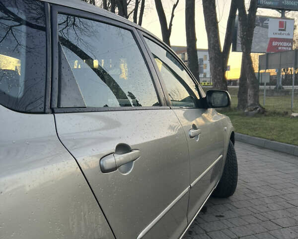 Жовтий Мазда 3, об'ємом двигуна 1.56 л та пробігом 190 тис. км за 3399 $, фото 5 на Automoto.ua