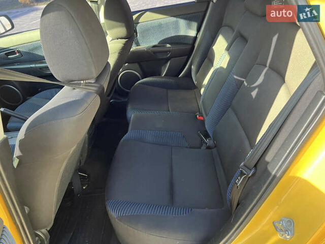 Желтый Мазда 3, объемом двигателя 2 л и пробегом 195 тыс. км за 6400 $, фото 11 на Automoto.ua