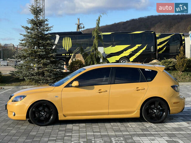 Желтый Мазда 3, объемом двигателя 2 л и пробегом 195 тыс. км за 6400 $, фото 5 на Automoto.ua