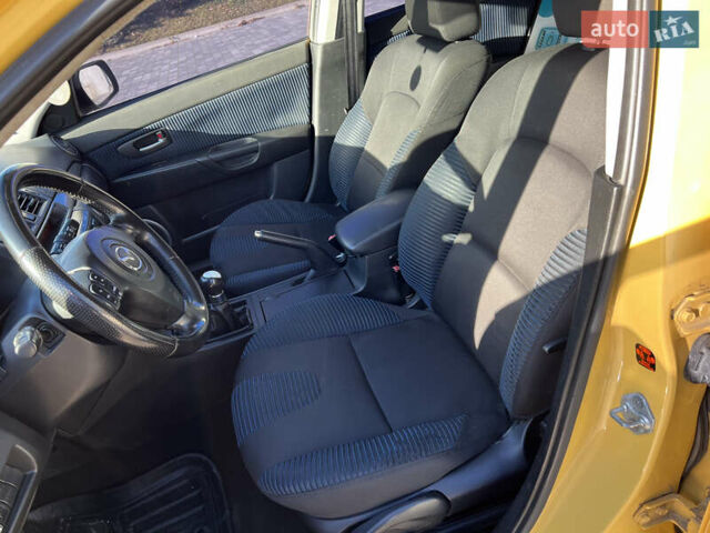 Желтый Мазда 3, объемом двигателя 2 л и пробегом 195 тыс. км за 6400 $, фото 10 на Automoto.ua