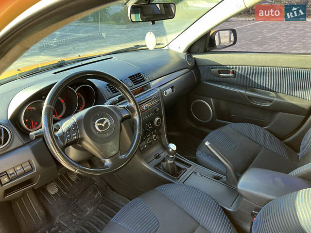Желтый Мазда 3, объемом двигателя 2 л и пробегом 195 тыс. км за 6400 $, фото 9 на Automoto.ua