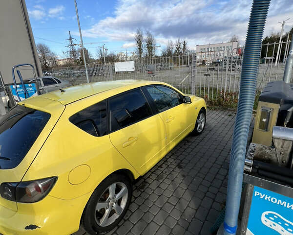 Жовтий Мазда 3, об'ємом двигуна 1.6 л та пробігом 206 тис. км за 4190 $, фото 5 на Automoto.ua