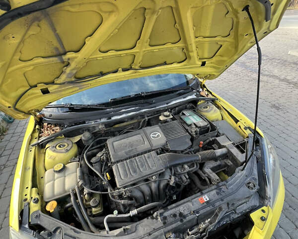 Жовтий Мазда 3, об'ємом двигуна 1.6 л та пробігом 206 тис. км за 4190 $, фото 16 на Automoto.ua