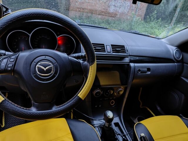 Жовтий Мазда 3, об'ємом двигуна 2 л та пробігом 254 тис. км за 4199 $, фото 7 на Automoto.ua