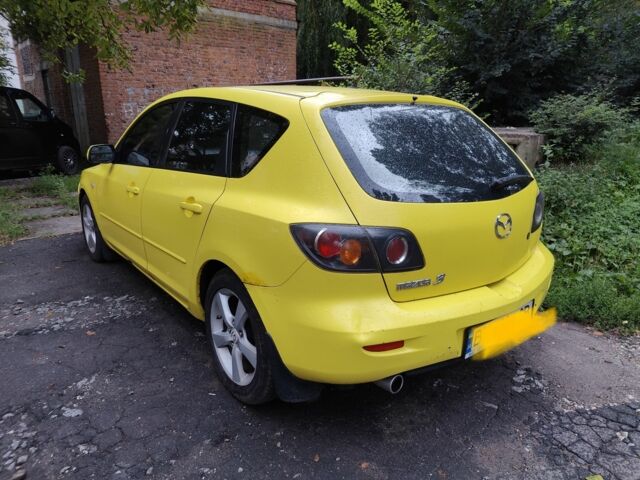 Жовтий Мазда 3, об'ємом двигуна 2 л та пробігом 254 тис. км за 4199 $, фото 2 на Automoto.ua