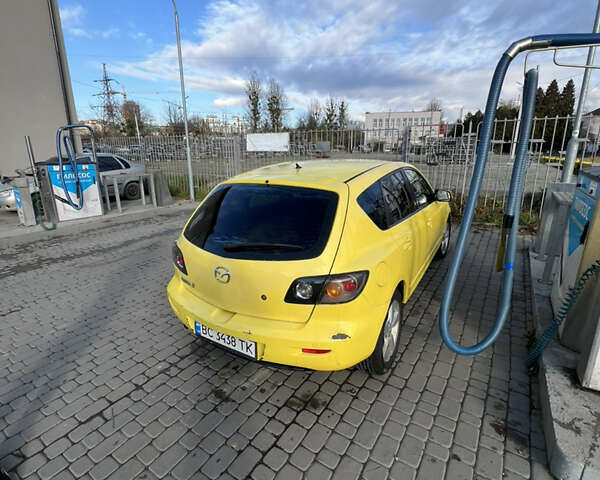 Жовтий Мазда 3, об'ємом двигуна 1.6 л та пробігом 206 тис. км за 4190 $, фото 4 на Automoto.ua