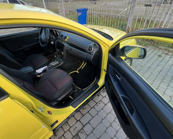 Жовтий Мазда 3, об'ємом двигуна 1.6 л та пробігом 206 тис. км за 4190 $, фото 13 на Automoto.ua