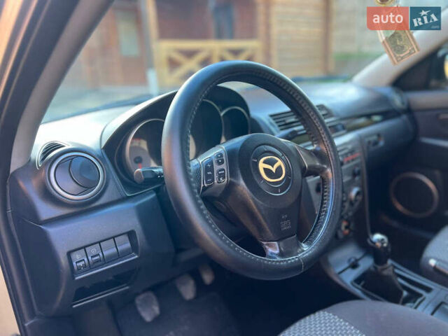 Мазда 3 2007 в Жовкве на Automoto.ua Желтый Мазда 3, объемом двигателя 1.6 л и пробегом 352 тыс. км за 3450 $, фото 13 на Automoto.ua