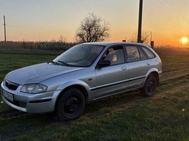 Серый Мазда 3, объемом двигателя 2 л и пробегом 250 тыс. км за 600 $, фото 2 на Automoto.ua