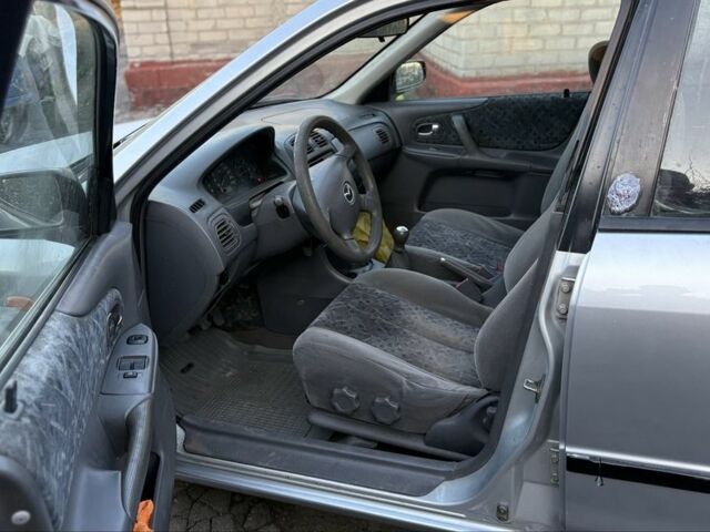 Серый Мазда 3, объемом двигателя 2 л и пробегом 250 тыс. км за 600 $, фото 5 на Automoto.ua