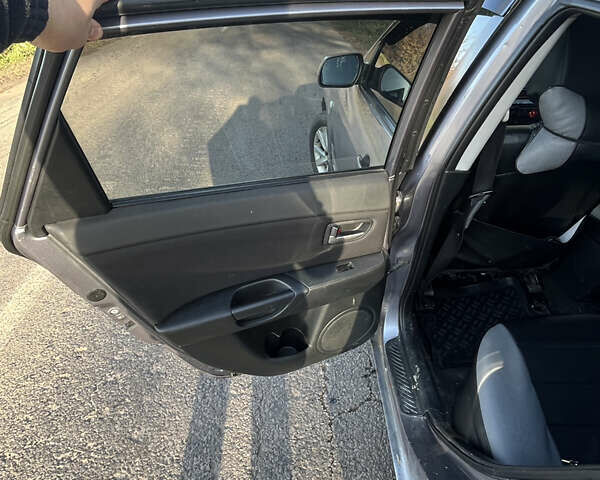 Серый Мазда 3, объемом двигателя 1.6 л и пробегом 467 тыс. км за 3400 $, фото 8 на Automoto.ua